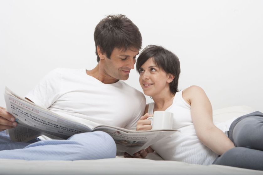 Hispanic couple at home in bed